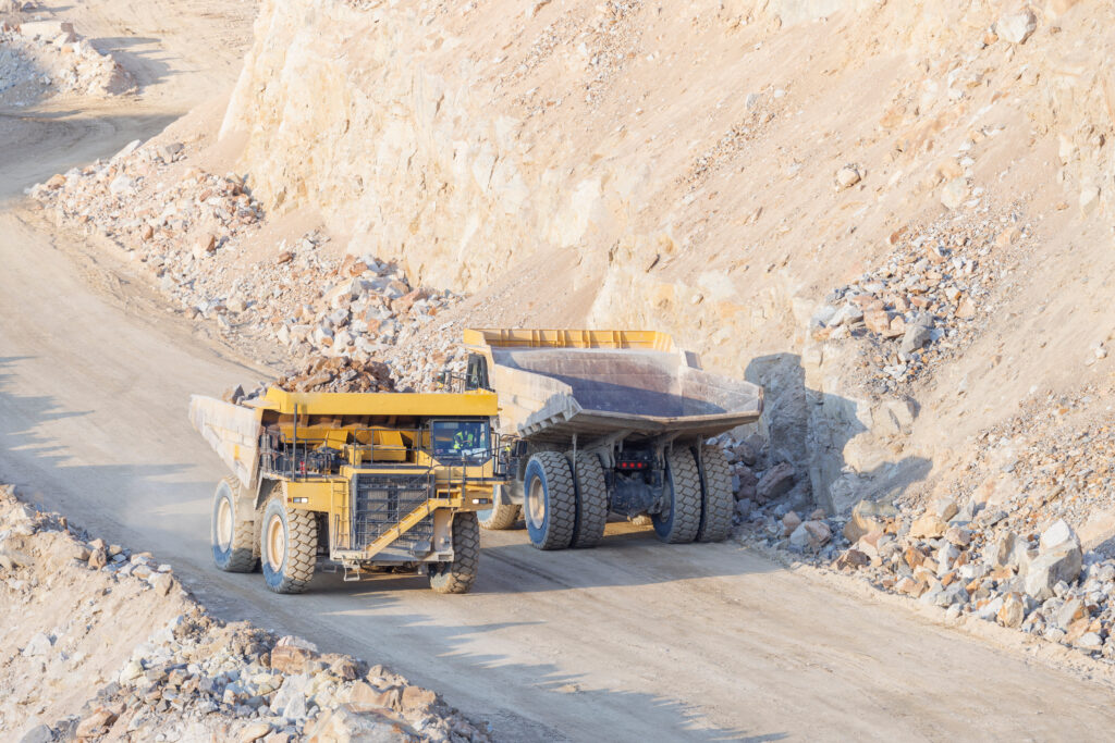 Picture of two trucks crossing at a Lithium Mine Operation